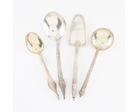 Group of four Siamese silver serving pieces including:One ladle with ornate handle, marked Siam sterling.One ladle with engra