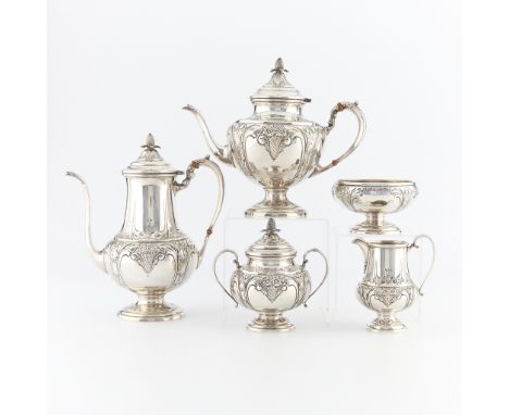 A five piece tea set including a coffee pot, teapot, covered sugar bowl, open, footed sugar bowl and creamer. Each piece of t