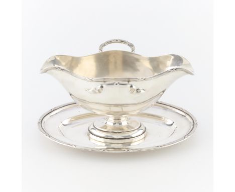 Austrian 800 silver double lipped sauceboat with side handles. With elegant, reeded details along the plate border, lip, and 
