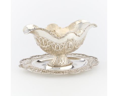 Hanau silver sauceboat in the medallion style. The sauceboat affixed with bolts to the tray. The tray also in the medallions 
