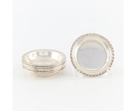 M. Fred Hirsch Co., United States. Group of eight small, round, sterling silver dishes. Each with a detailed rope rim and ini