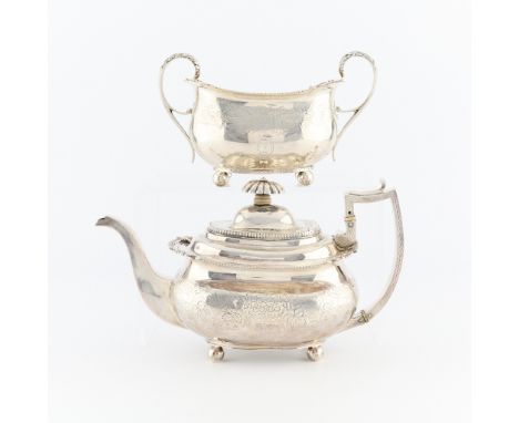 Sterling silver teapot and sugar bowl of similar ivy leaf pattern.The teapot heavily decorated with floral and vegetal patter