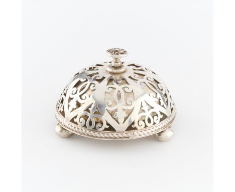 An English sterling Silver desk bell. The bell comprised of a sterling filigree exterior sterling finial. Marked along the fi