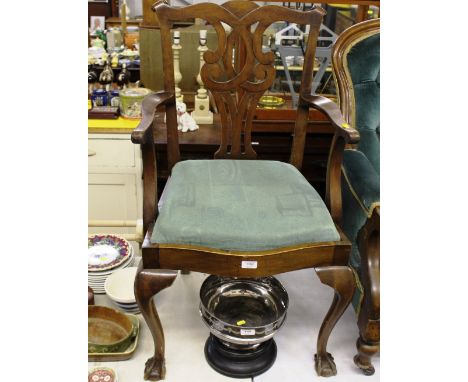 A Chippendale style mahogany carver chair raised on claw and ball supports