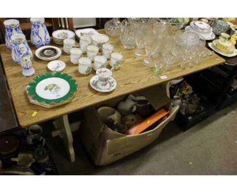 A light oak dining table, with a set of four oak chairs 