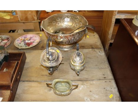 A large silver plated punch bowl with ladle; two teapots and a sugar bowl