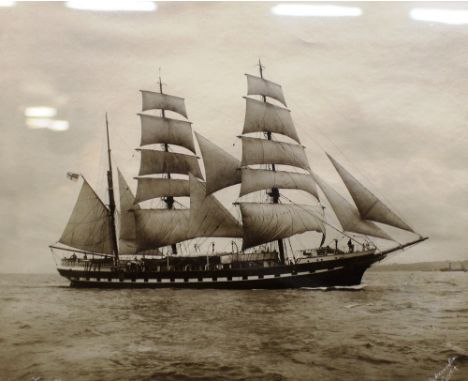 A 1920's black and white photographic print depicting a three masted sailing ship 