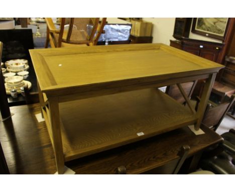 A modern light oak two tier coffee table