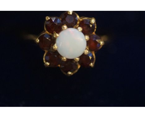 9ct Gold cluster ring set with central opal, surrounded by garnets Size P