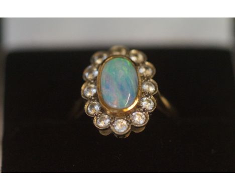 9ct Gold ring set with opal &amp; clear stones