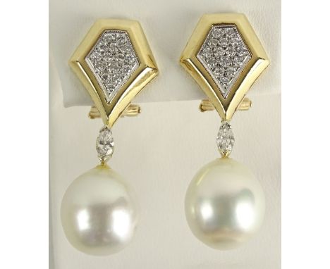 Lady's Vintage 14 Karat Yellow Gold, Diamond and Pearl Earrings. Pearls Measure approx. 14.5mm. Signed 14K. Good Condition or