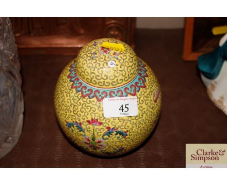 A Chinese enamel and yellow ginger jar and cover with red seal mark to base