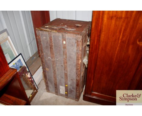 A vintage wooden and metal bound trunk