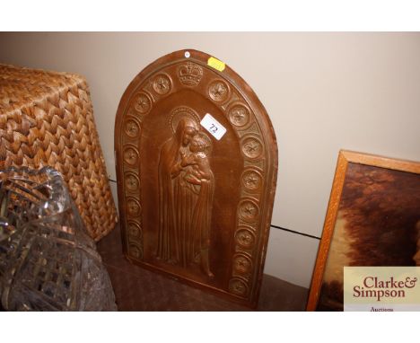 A copper Ecclesiastical panel depicting Madonna and Child within a crown and stellar border