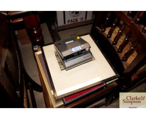 A collector's Polaroid camera and various framed and glazed prints 