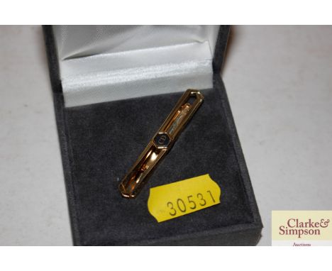 A Christian Dior tie pin 