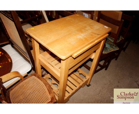 A light wood mobile kitchen trolley