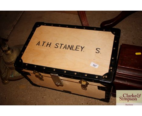 A wooden and metal bound storage trunk