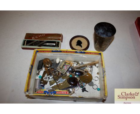 A box of miscellaneous items to include Eastern brass beaker, costume jewellery, harmonica etc.