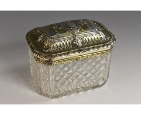 A 19th century silver-gilt and hobnail-cut glass canted rectangular caddy, hinged cover chased with cartouches, swags, acanth