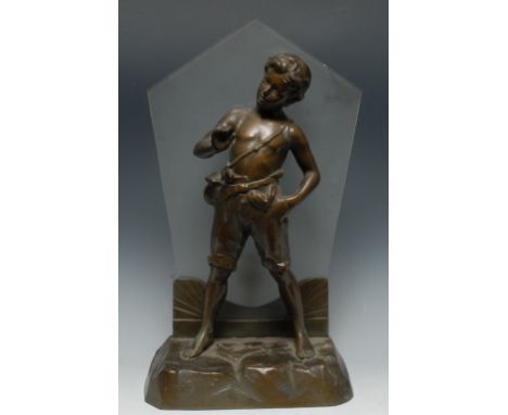 An Art Deco brown patinated and frosted glass figural table lamp, centred by a cast figure of an urchin boy, standing proud o