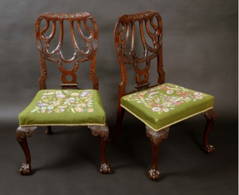 A pair of 19th century mahogany side chairs, possibly American, shaped and pierced backs carved with acanthus, stuffed over t
