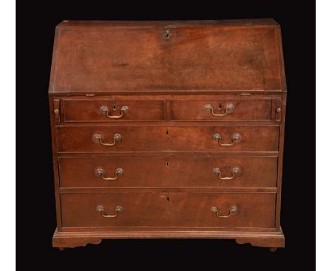 A George III mahogany bureau, fall front enclosing a fitted interior, above two short and three long graduated cockbeaded dra