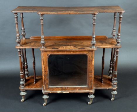 A Victorian walnut and marquetry break-centre music room side cabinet, the two open tiers with matched veneers above a glazed