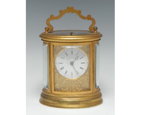 A 19th century gilt brass oval carriage clock, 6cm circular enamel dial with Roman and subsidiary Arabic numerals, the ground