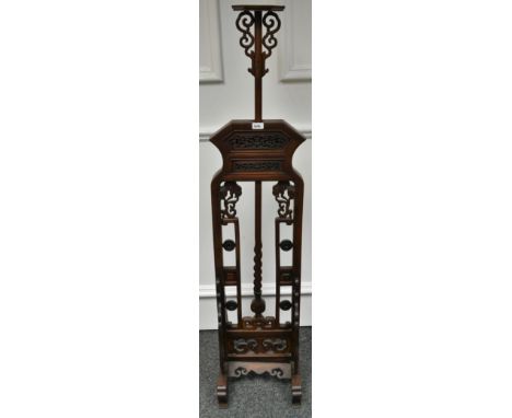 A Chinese padouk wood adjustable lamp stand, carved throughout with scrolls, 153cm high extending to 179cm, 34cm wide, c.1900