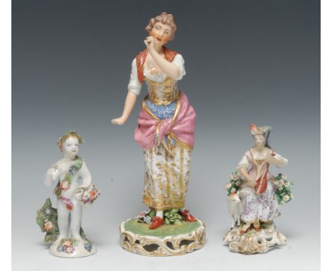 A Derby figure, of a girl dancing, in rural dress, pierced circular base, 27cm high, crown and crossed swords in D, c.1790; a