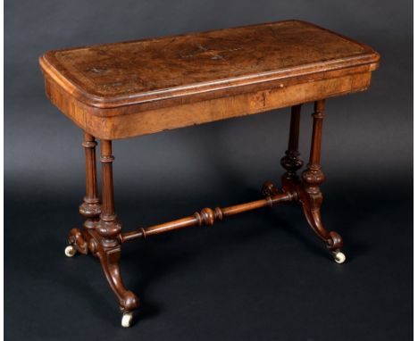 A Victorian burr walnut and marquetry rounded rectangular card table, amboyna crossbanded folding top enclosing an inset baiz