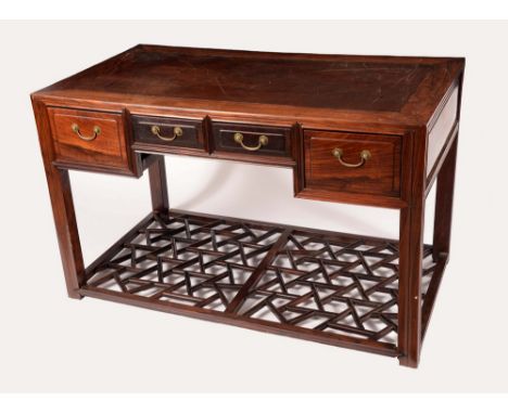 A Chinese padouk wood rectangular scholar's desk, panel top above an arrangement of four frieze drawers, moulded square legs,
