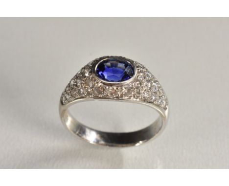 A ceylon sapphire and diamond ring, central oval vibrant blue sapphire approx 1.08ct, within a pave encrusted diamond surroun