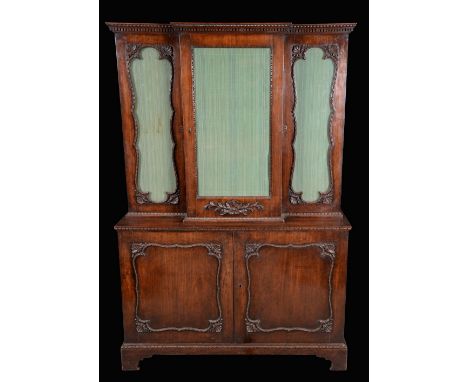 A George III mahogany break-centre bookcase, of small proportions, dentil cornice above a rectangular glazed door flanked by 