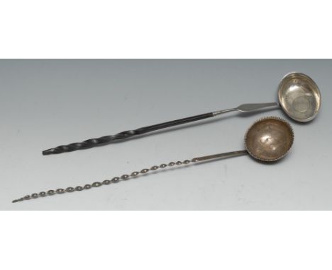 An 18th century silver coloured toddy ladle, wrythen whale bone handle, c.1760; another  (2)