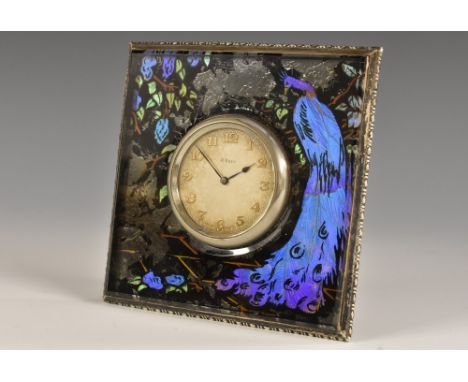 An Art Deco silver-mounted verre églomisé boudoir timepiece, 4cm dial applied with Arabic numerals, eight-day Swiss movement,