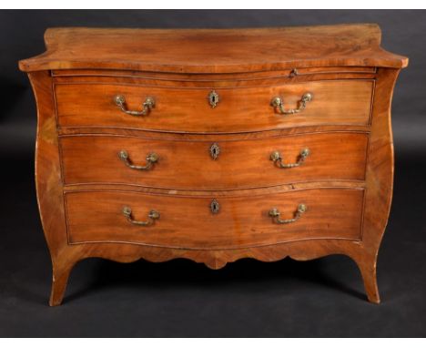 A George III Chippendale period mahogany serpentine chest, oversailing crossbanded top above a slide and three long graduated