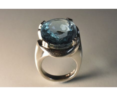 An oval Santa Maria aquamarine solitaire ring, designed by Kate Lesel, single large oval aquamarine measuring approx 21mm x 1