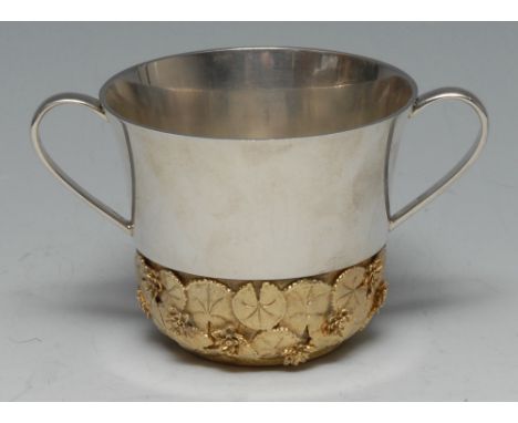 Stuart Devlin (1931 - 2018) - an Elizabeth II parcel-gilt silver porringer, to commemorate the Christening of Prince William,