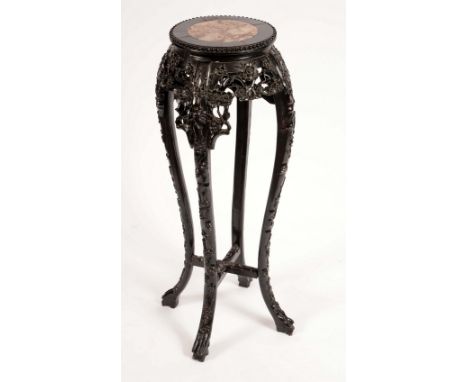 A Chinese padouk wood jardiniere stand, circular top with inset soapstone panel, beaded border, the shaped frieze and cabriol