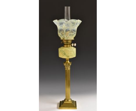 A 19th century vaseline glass and gilt-brass oil lamp, wavy shade, marbled glass reservoir, Corinthian column, stepped square
