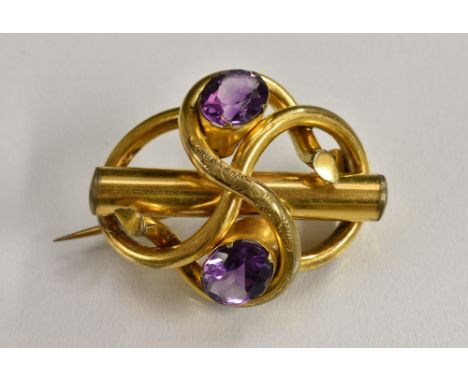 A Victorian two stone amethyst scrolling knot and bar brooch, total amethyst weight approx 4.83ct, gilt metal body, 40mm wide