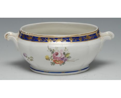 A Chelsea Derby two handled sauce tureen, decorated with floral spray, banded in blue and applied with gilt scrolling foliage