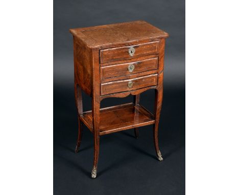 A Louis XV design rosewood serpentine fronted boudoir commode, oversailing top above three drawers, crossbanded and outlined 