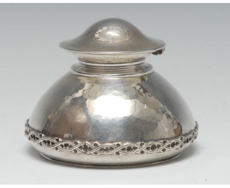 Omar Ramsden - an Arts and Crafts silver domed inkwell, hinged cover, planished overall and applied with a band of entwined t