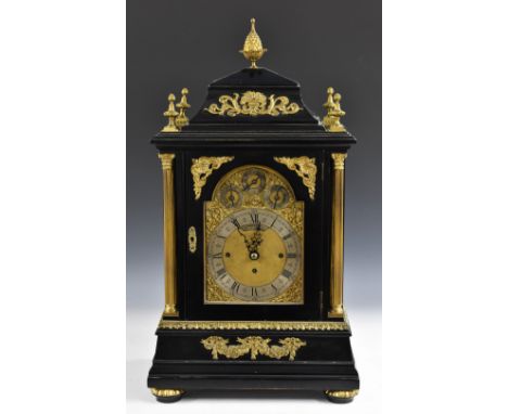 A substantial Victorian ormolu mounted ebonised musical bracket clock, 18cm arched brass dial inscribed Kirk &amp; Company Li