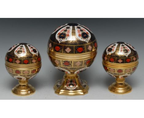 A Royal Crown Derby 1128 pattern Millennium globe clock, commissioned by Sinclairs, limited edition, 54/1,000, boxed; a simil