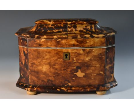 An early Victorian tortoiseshell canted bow fronted tea caddy, hinged pagoda top enclosing a pair of lidded compartments, ski