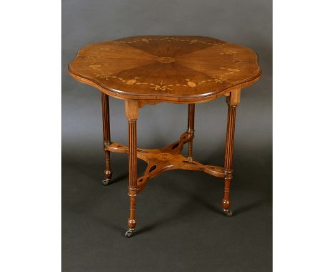 A late Victorian rosewood and marquetry shaped circular centre table, the moulded top with radiating veneers inlaid with pate